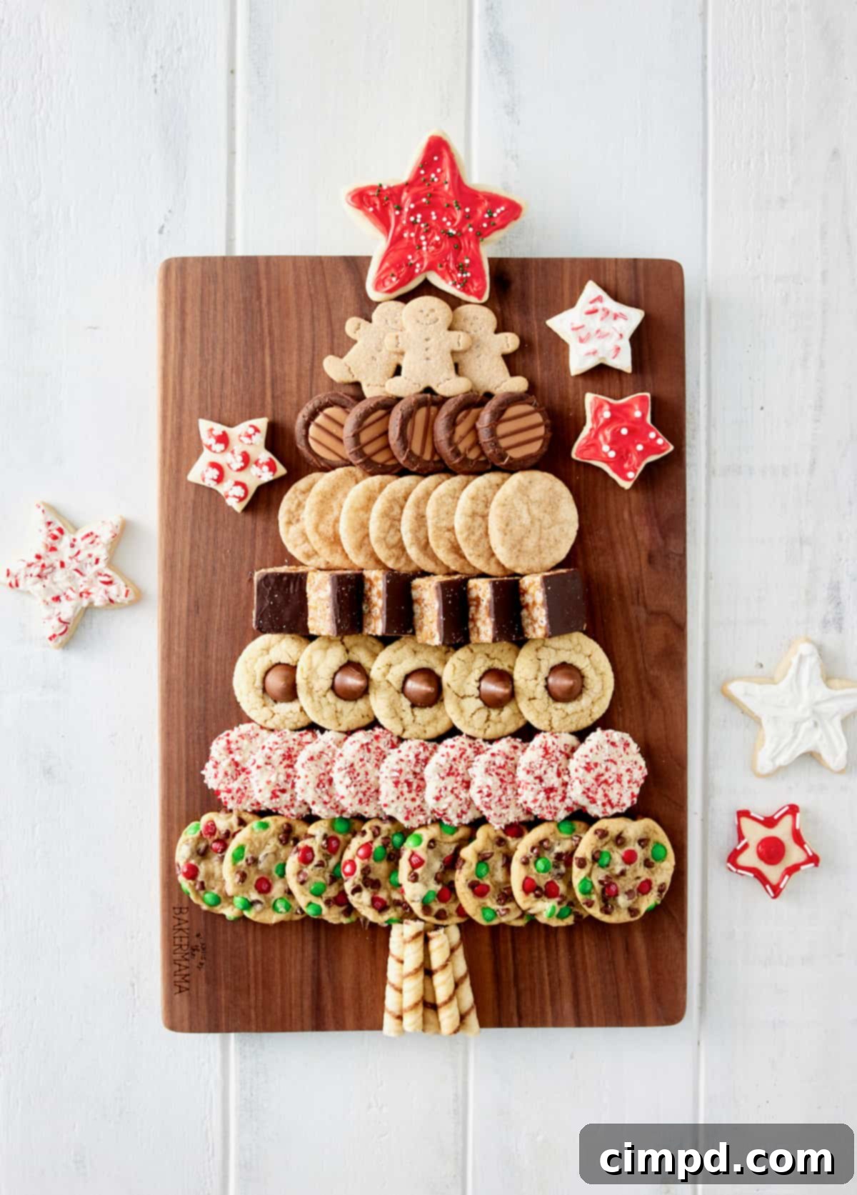 The final assembled Christmas Tree Cookie Board, showcasing an abundant array of holiday cookies meticulously arranged in a tree shape with a prominent star topper, ready for serving.