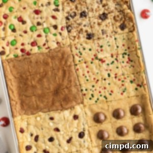 Six kinds of holiday cookies baked into one cookie sheet sitting on a white counter top.