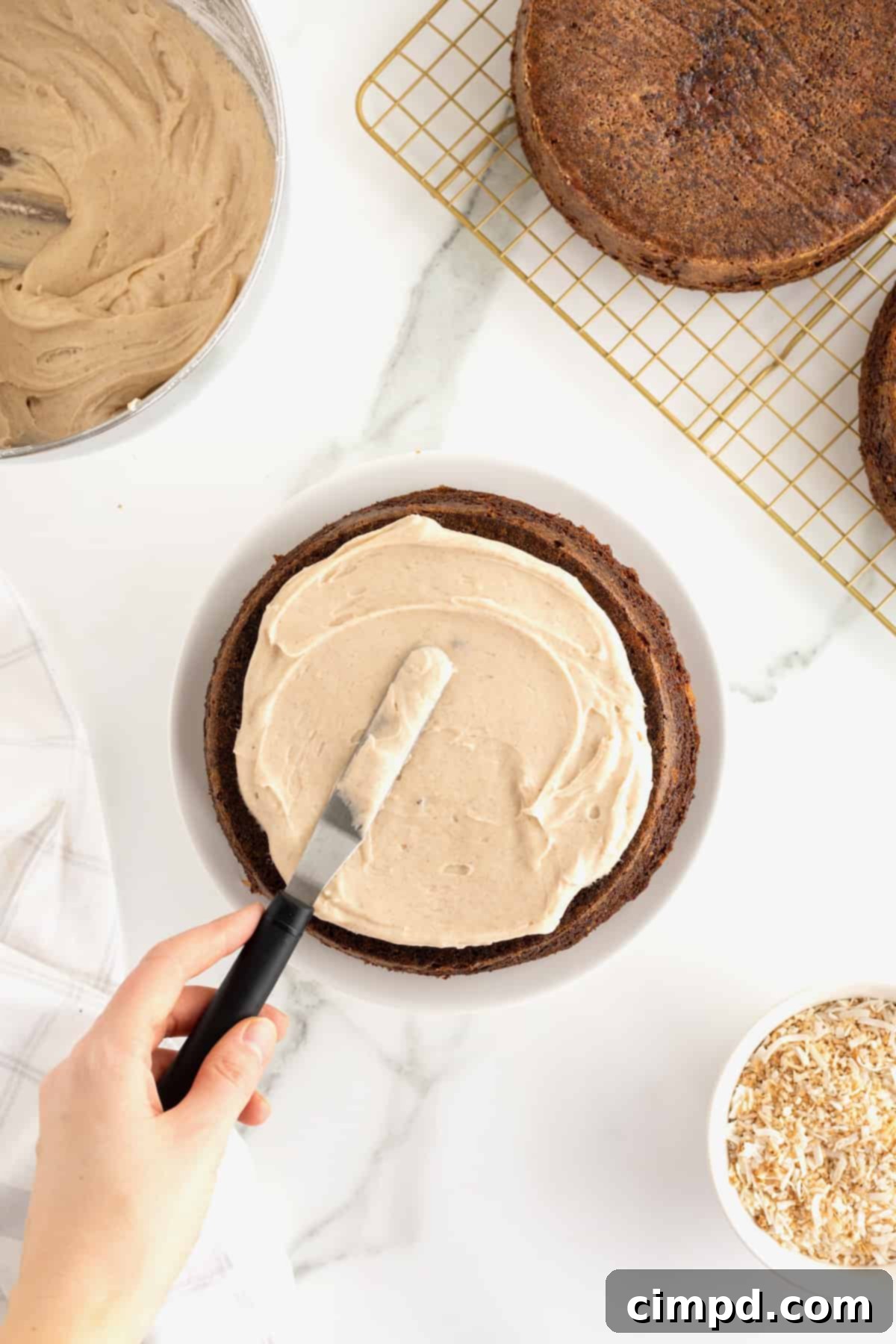 Warmly Spiced Carrot Coconut Cake with Tangy Cream Cheese Frosting 11 Coconut Carrot Cake with Cinnamon Cream Cheese Frosting by The BakerMama