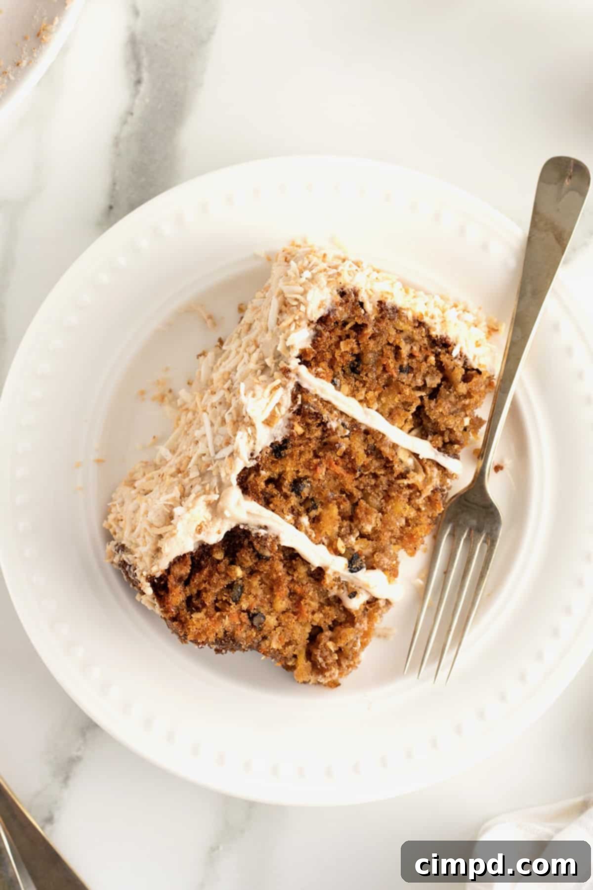 Warmly Spiced Carrot Coconut Cake with Tangy Cream Cheese Frosting 13 Coconut Carrot Cake with Cinnamon Cream Cheese Frosting by The BakerMama