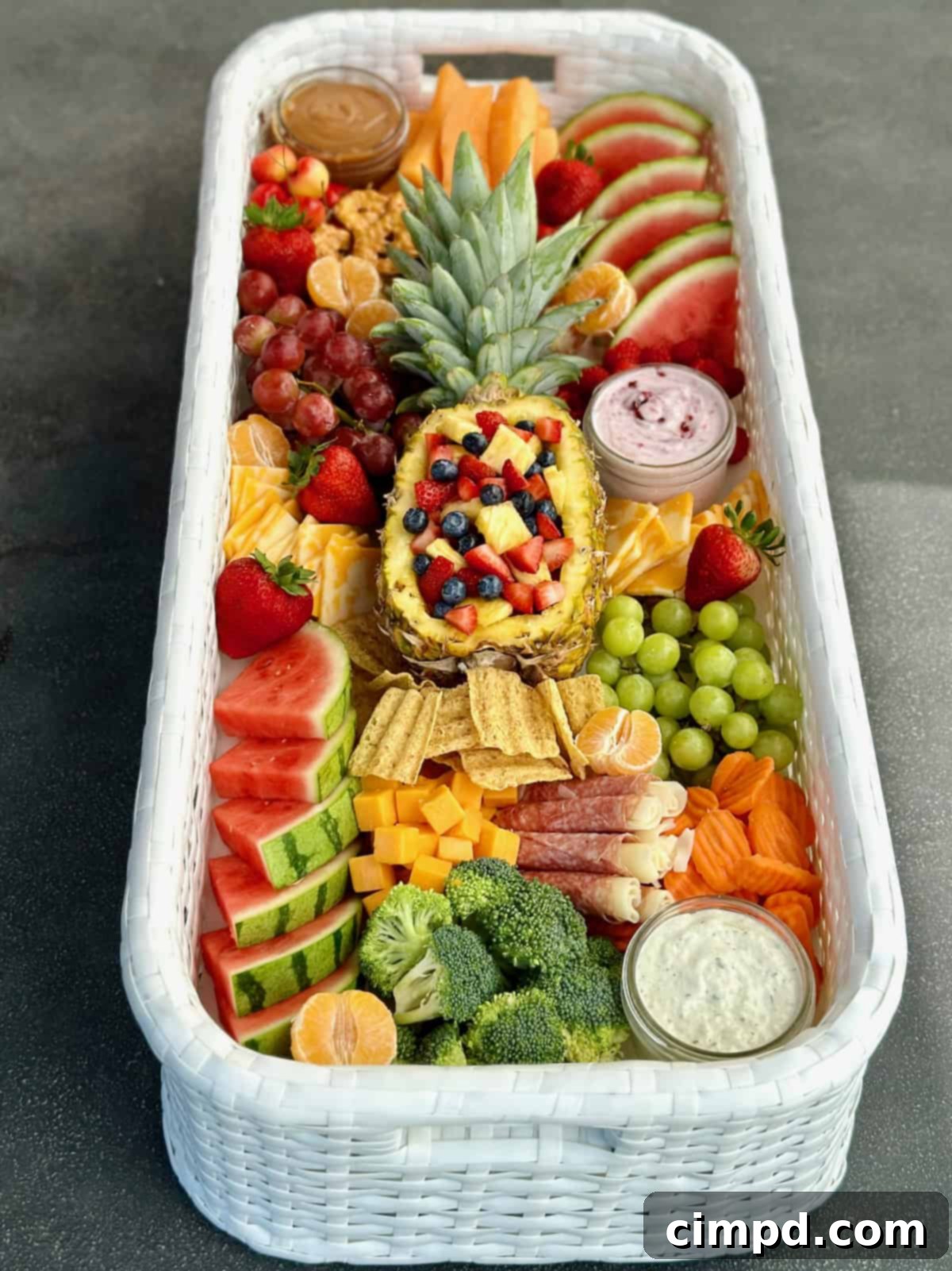 An overhead shot of a luxurious floating snack tray, brimming with an organized assortment of fresh fruits, savory cheeses, and crunchy crackers, ready to be enjoyed in the pool.