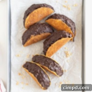 Frozen Chocolate Taco Treats 13 Six choco tacos on a parchment lined aluminum baking sheet.