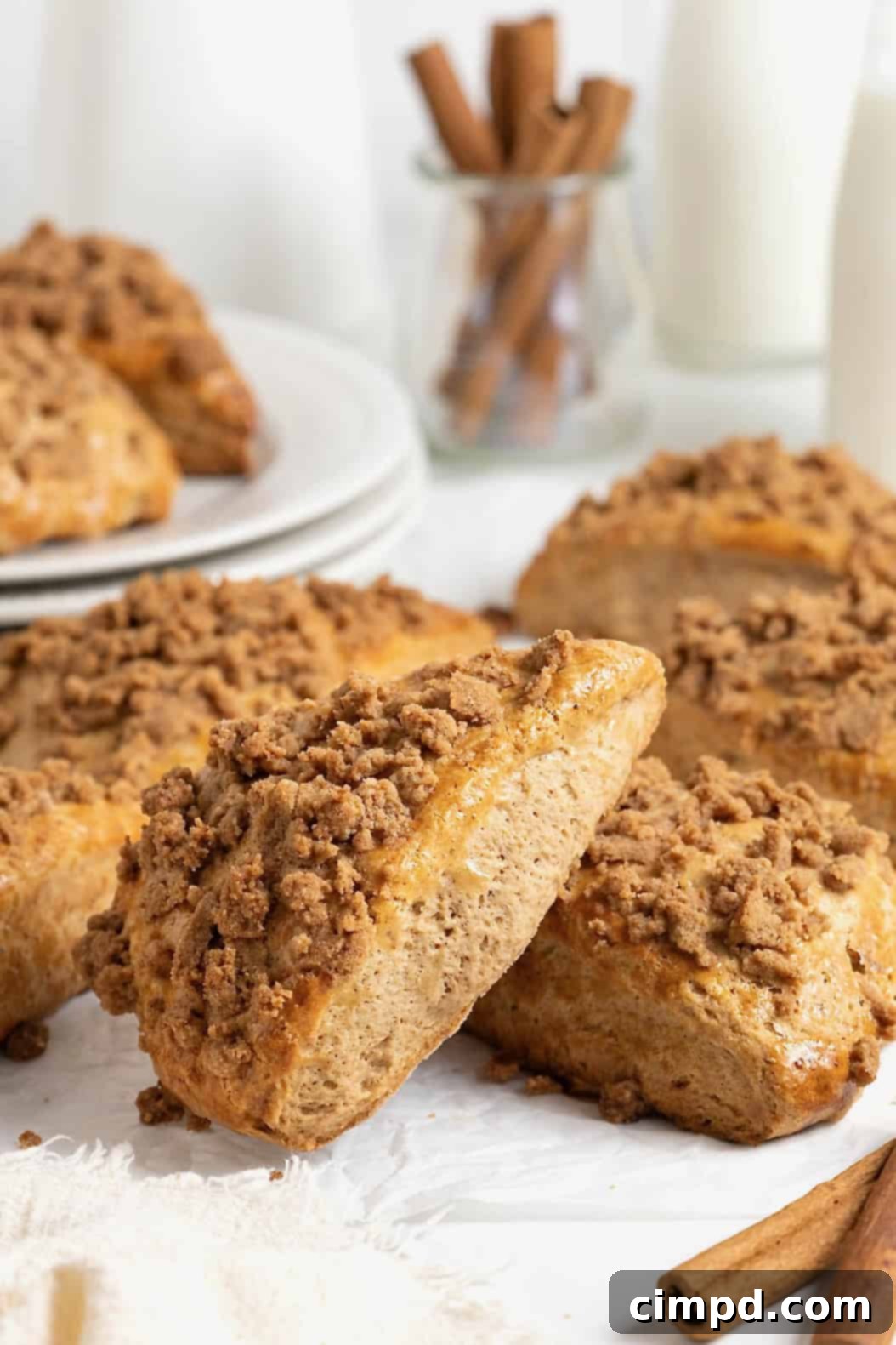 A delectable pile of snickerdoodle streusel scones, showcasing their golden-brown tops and rich texture.