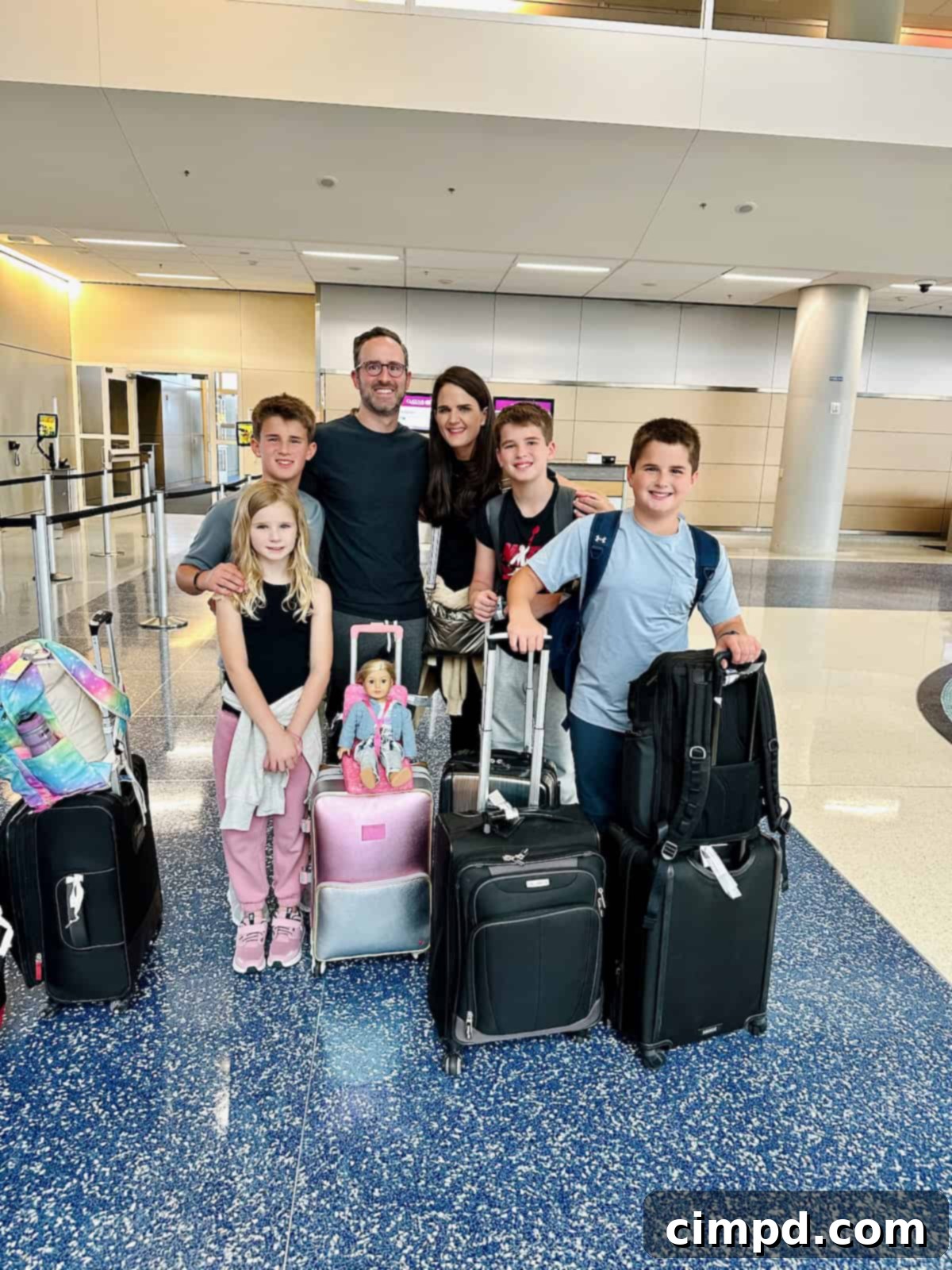 Exploring the Wonders of South Africa and Zambia 5 The Brown Family standing with their suitcases in an airport, ready for their African adventure.