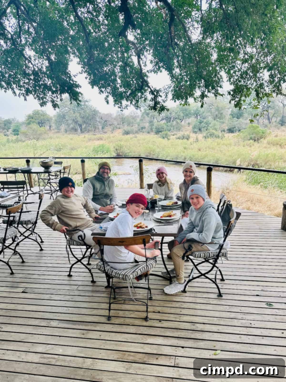Our family wearing beanies during breakfast at Lion Sands, overlooking the Sabie River.
