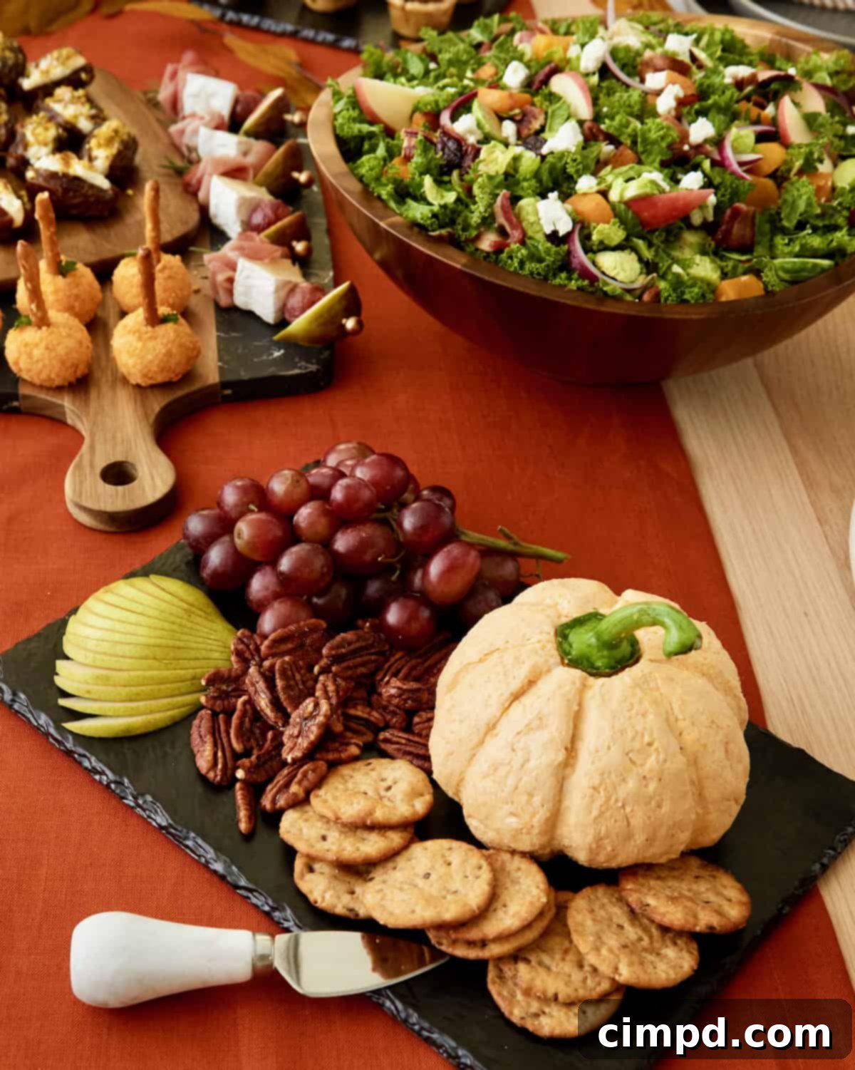 Thanksgiving table with an assortment of delicious dishes including turkey, stuffing, and salads.