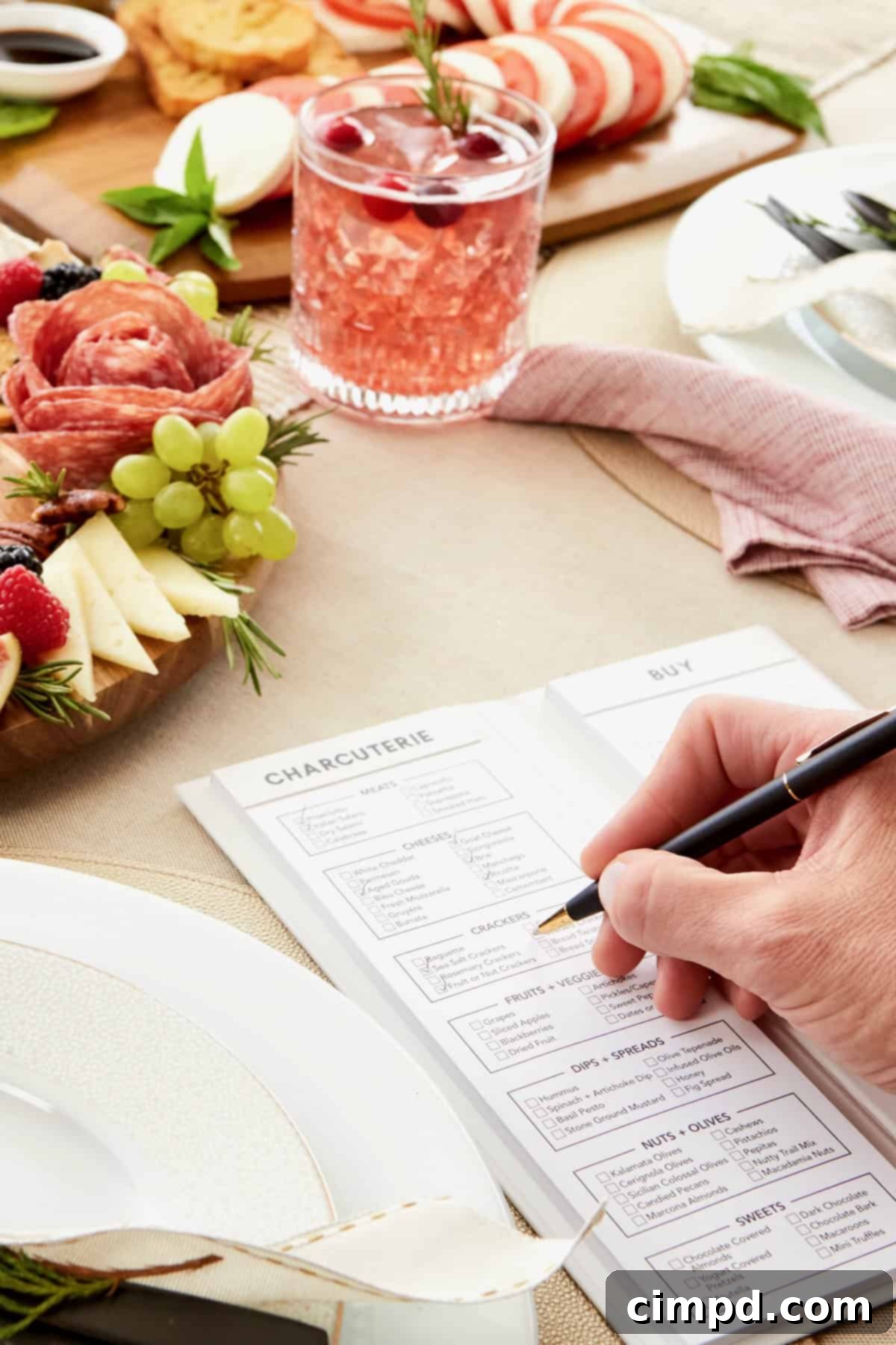 Beautifully set Christmas dining table with sparkling decorations and individual place settings.