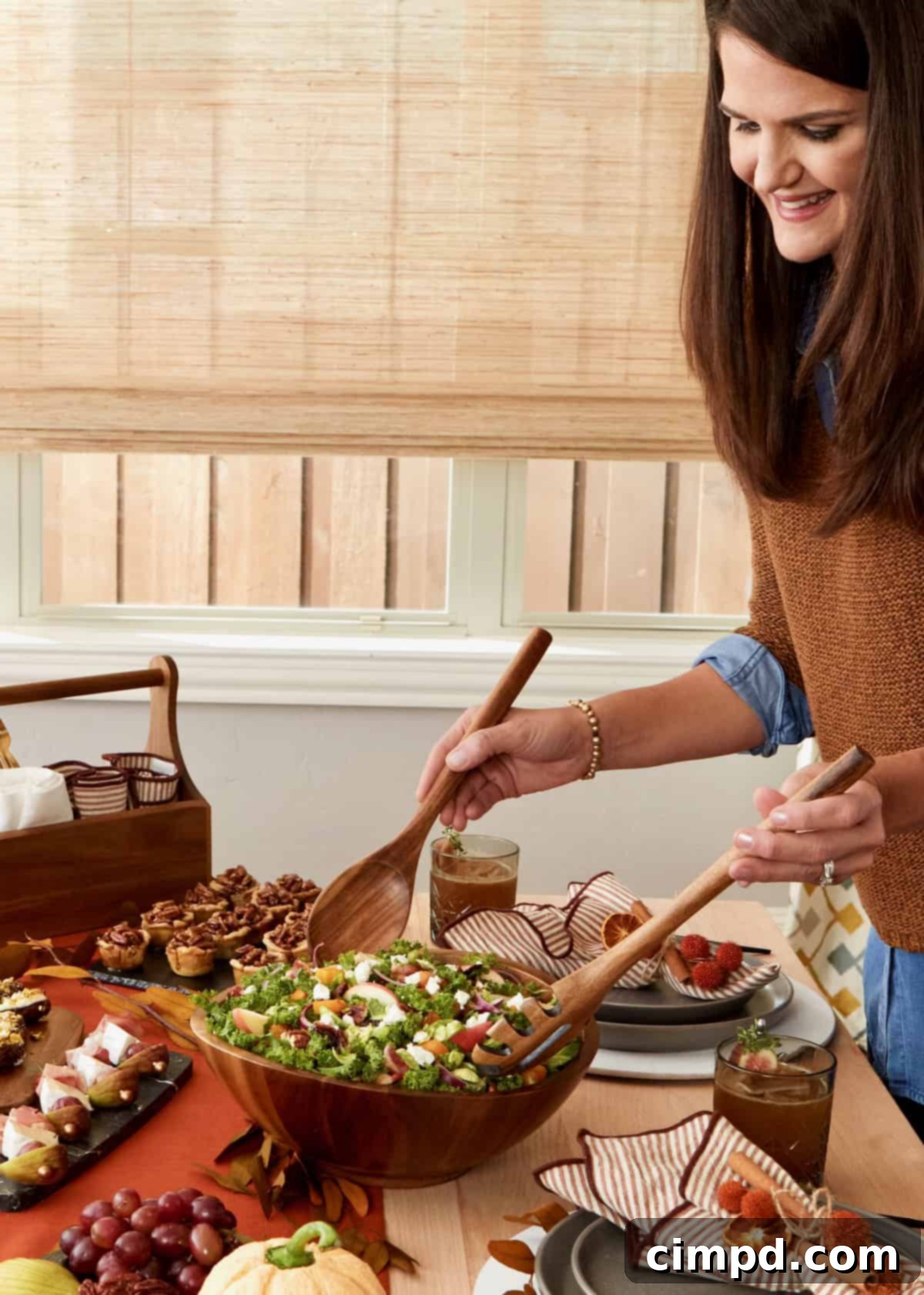 Thanksgiving table laden with a variety of festive dishes and elegant decor.