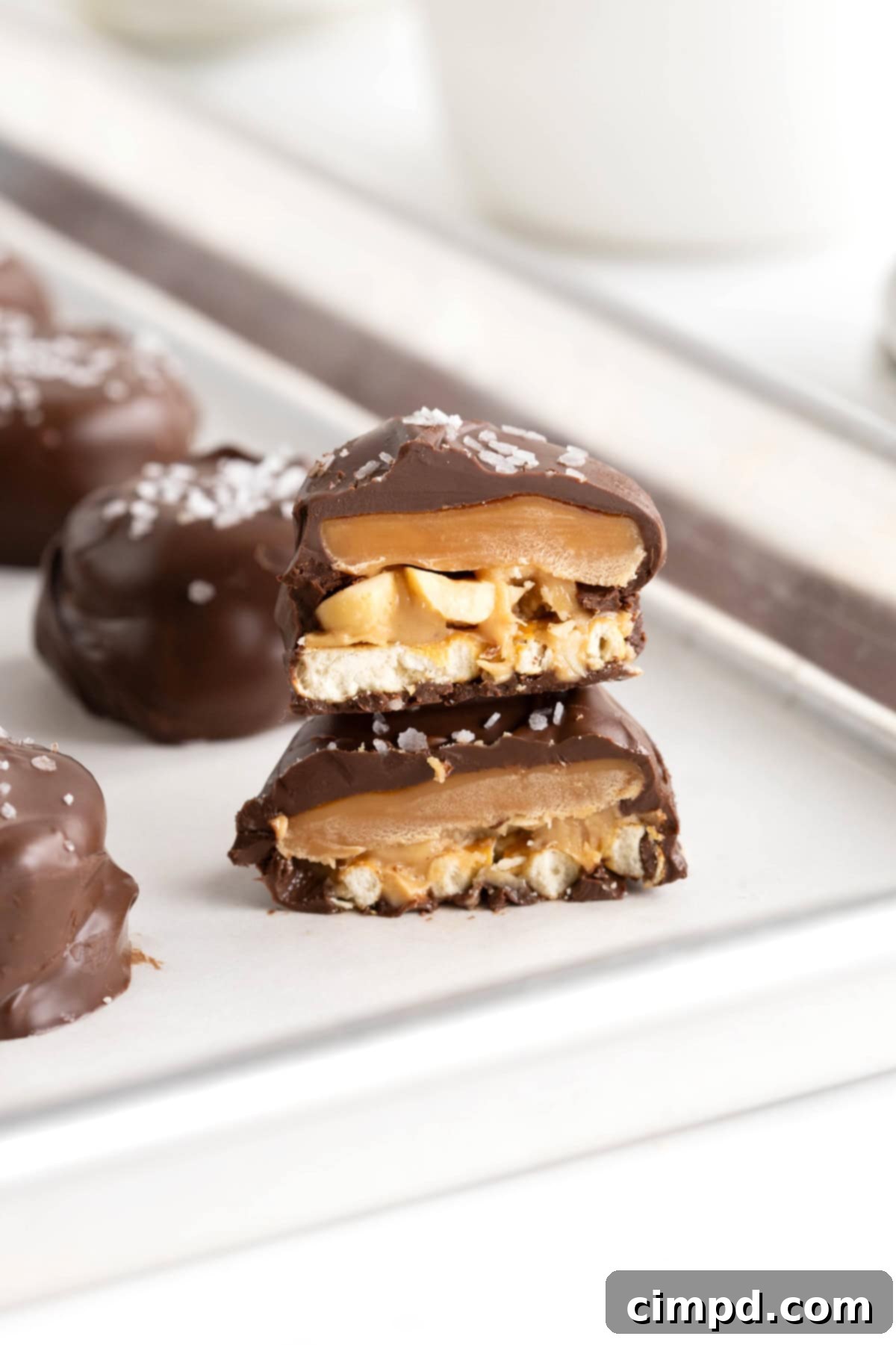 Two Take 5 Bites stacked on a parchment lined baking tray.
