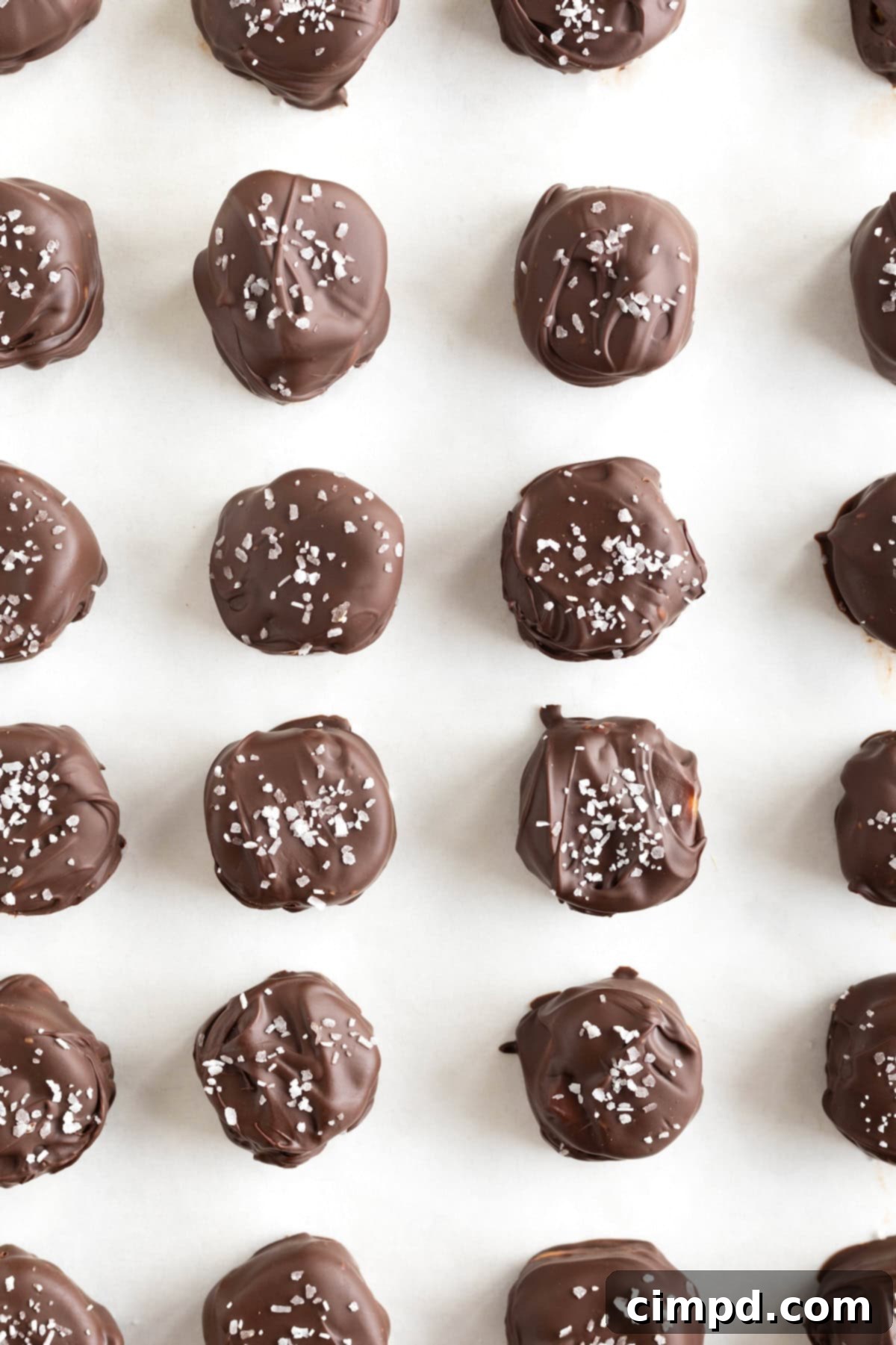 ake 5 Candy Bar Bites on a parchment lined aluminum baking sheet.