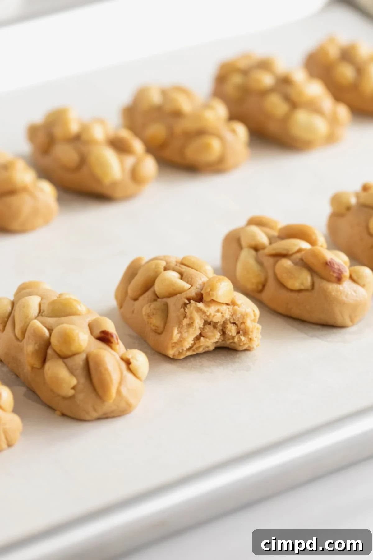 PayDay Treat Squares 4 10 miniature payday candy bars on a parchment lined surface.