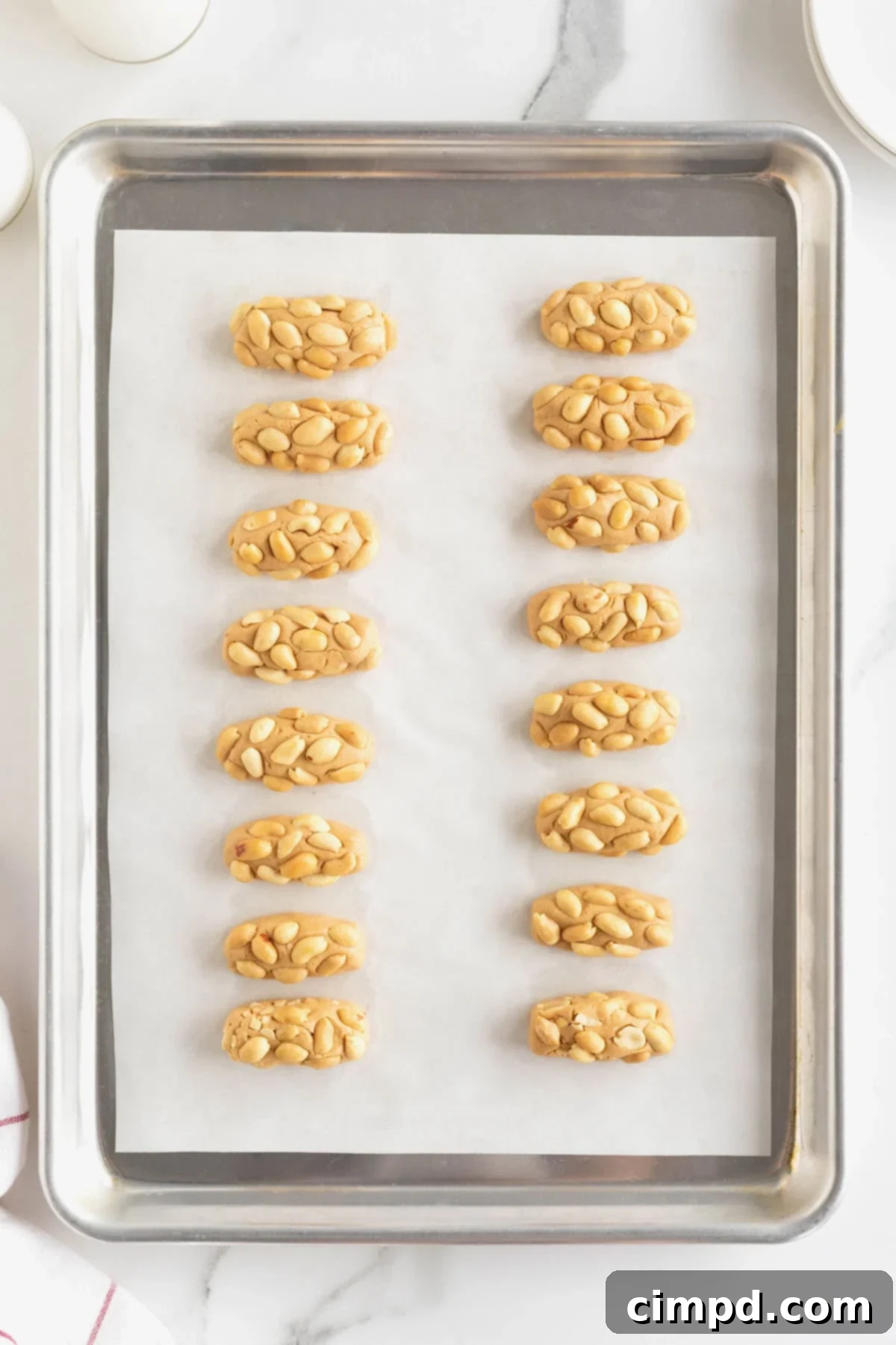 PayDay Treat Squares 8 16 miniature payday candy bars on a parchment lined surface.