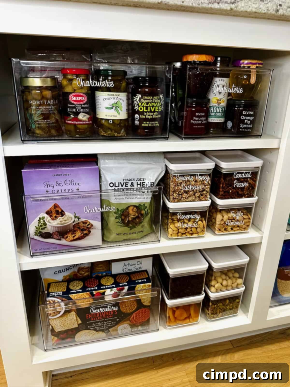 An inviting display of charcuterie ingredients, including a variety of nuts, colorful dried fruits, and artisanal crackers, perfect for building a gourmet board.