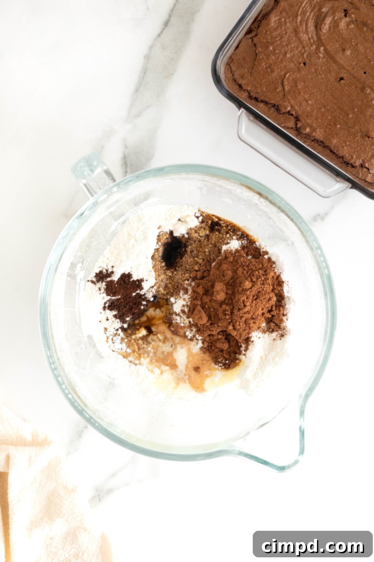 Mocha Velvet Brownies 9 A glass mixing bowl with ingredients to make espresso buttercream frosting.
