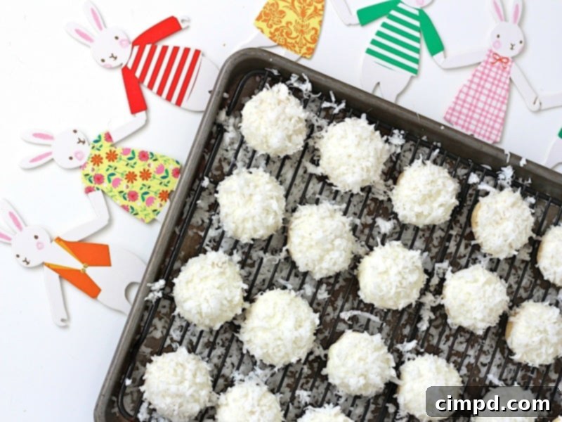 Fluffy White Chocolate Coconut Bunny Tails 6 Sprinkling coconut flakes on white chocolate dipped cookies