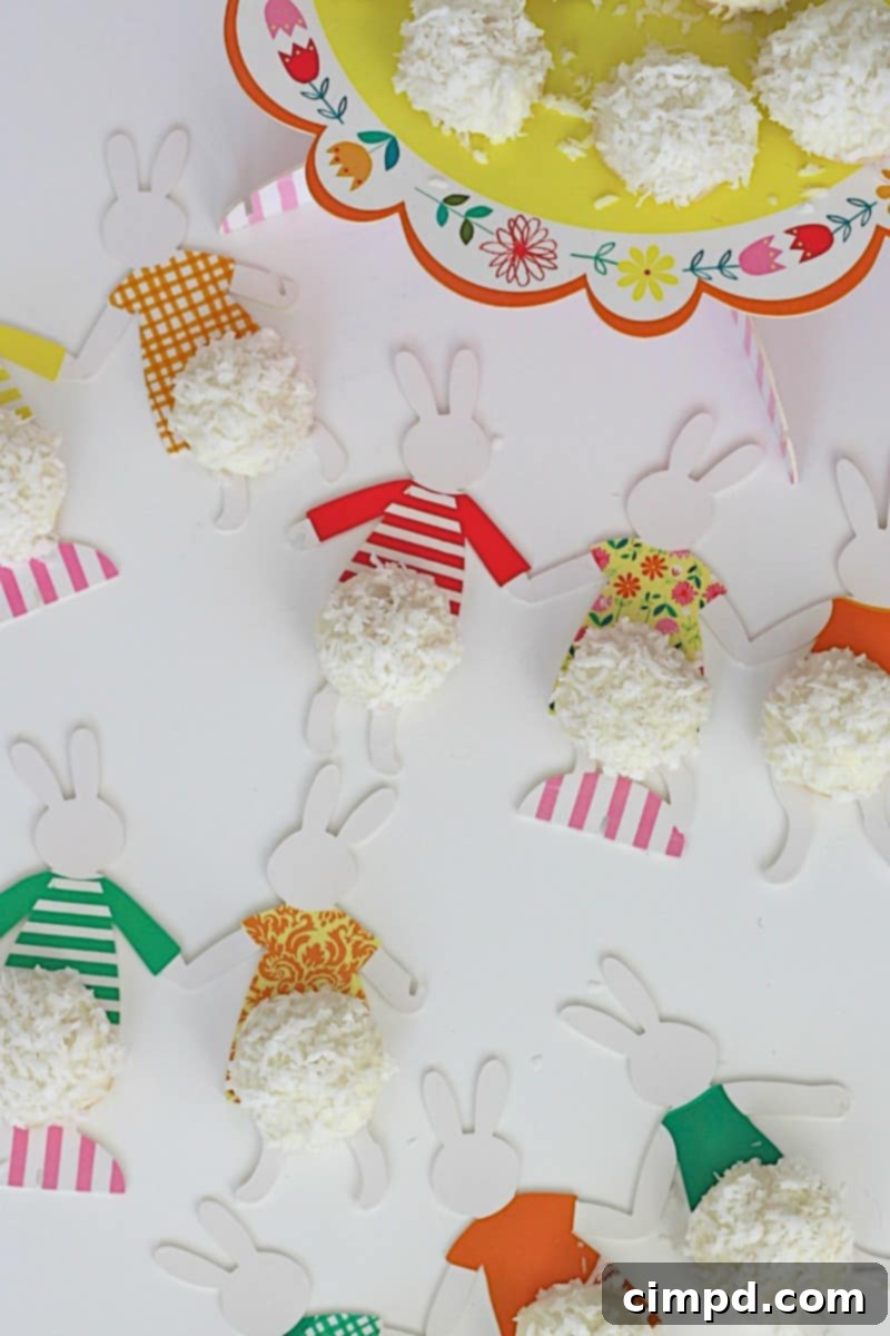 Fluffy White Chocolate Coconut Bunny Tails 7 Close-up of a White Chocolate Dipped Coconut Bunny Tail Cookie with a festive ribbon