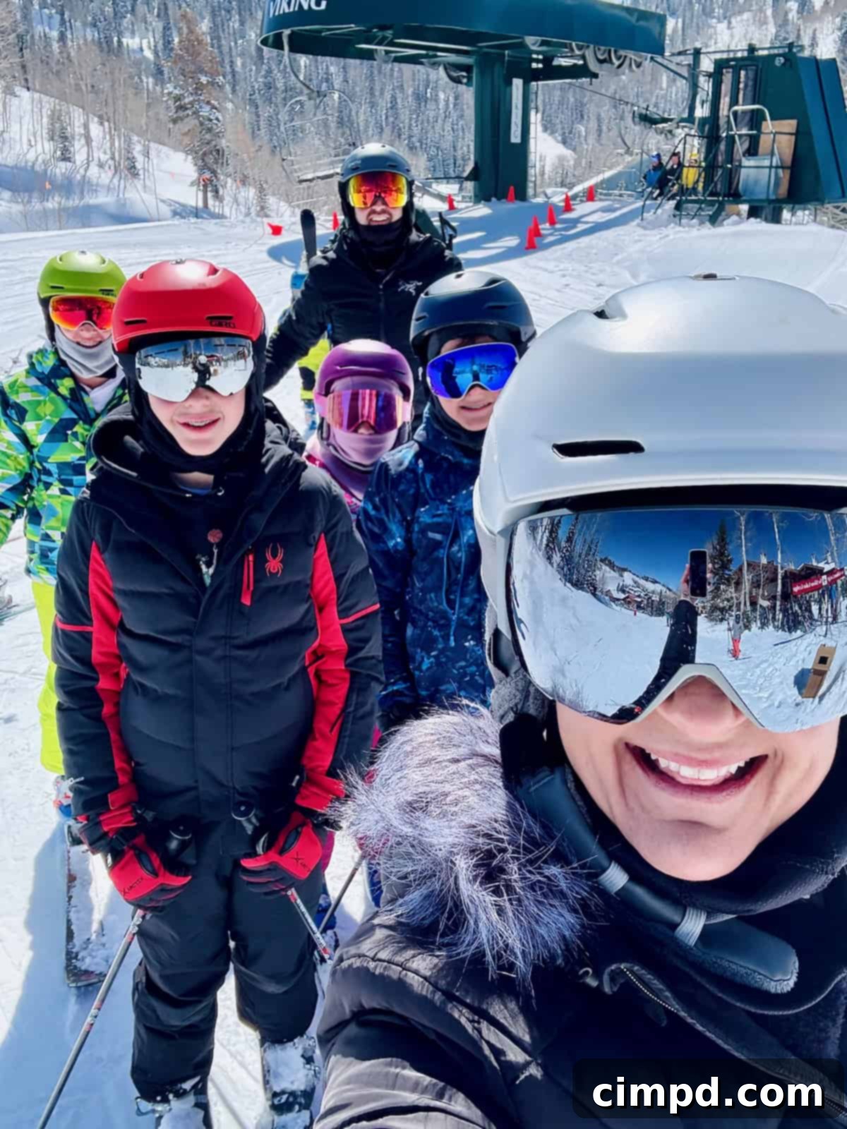 The Brown family smiling after an exhilarating day of skiing in Deer Valley.