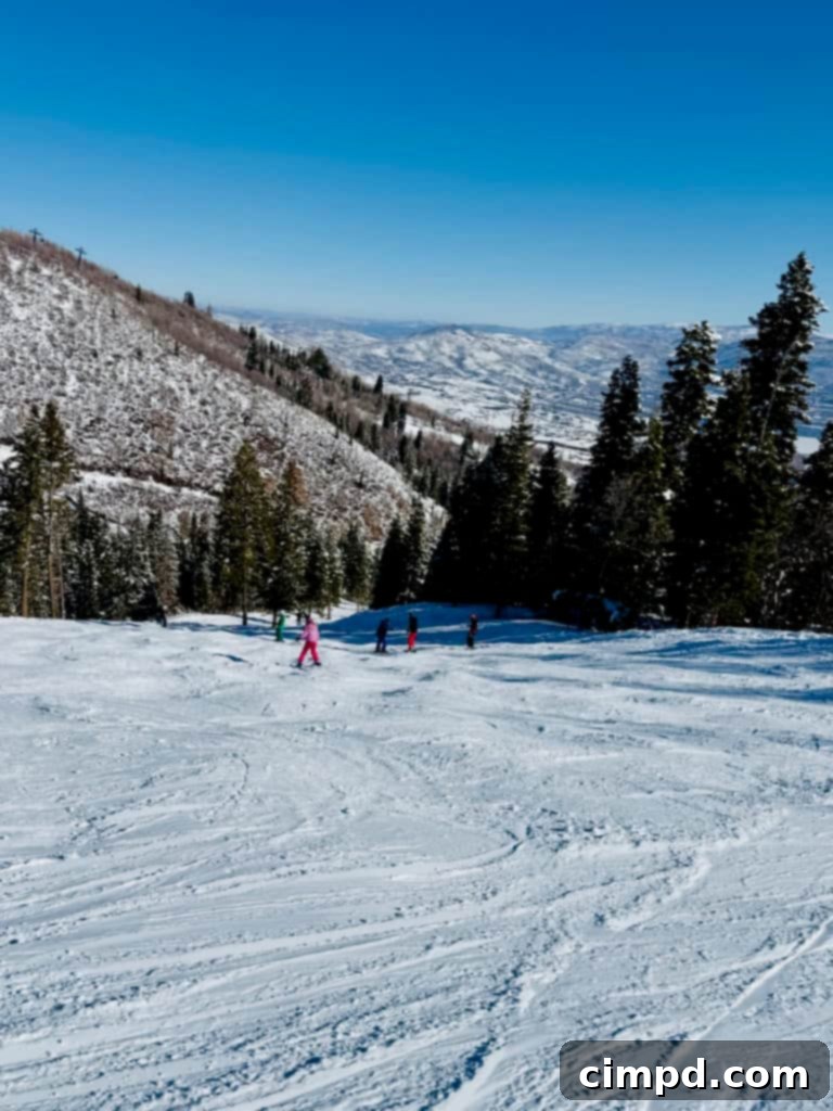 A stunning view of Deer Valley Resort with skiers enjoying the pristine snow.