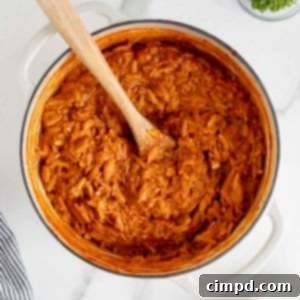 One-Pot Sloppy Joe Orzo 12 A white Dutch oven of sloppy Joe orzo on a white marble counter.