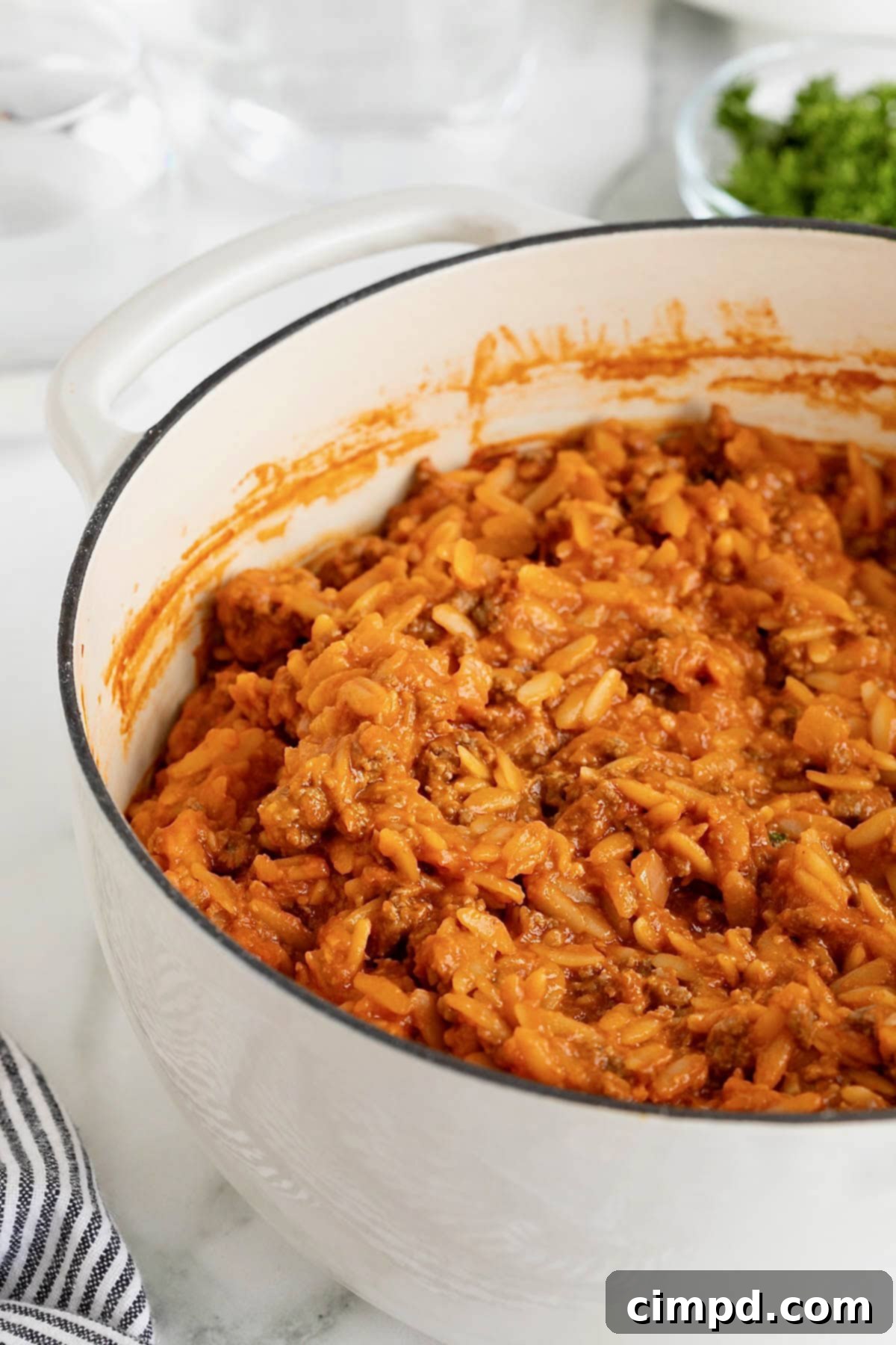 One-Pot Sloppy Joe Orzo 10 A white dutch oven of sloppy Joe orzo.