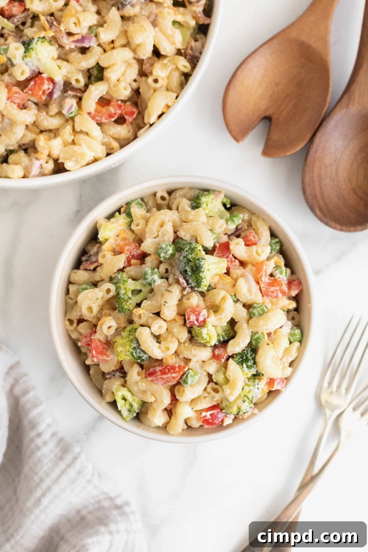 A beautifully presented bowl of creamy bacon ranch macaroni salad, showcasing its vibrant colors and inviting texture.