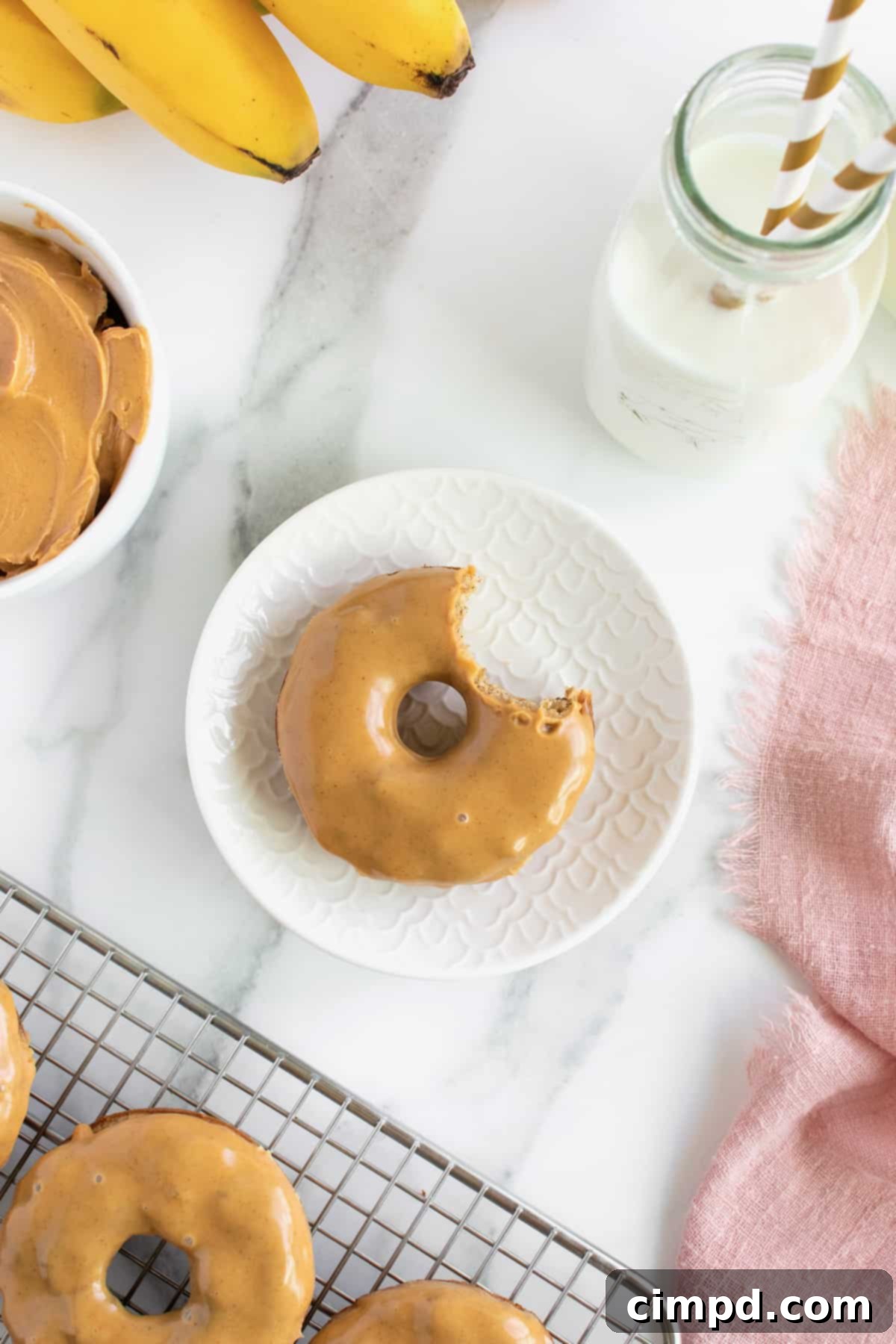 Close-up of freshly baked Whole Wheat Banana Donut with Peanut Butter Glaze, showing its soft texture, perfect for a healthy breakfast or snack