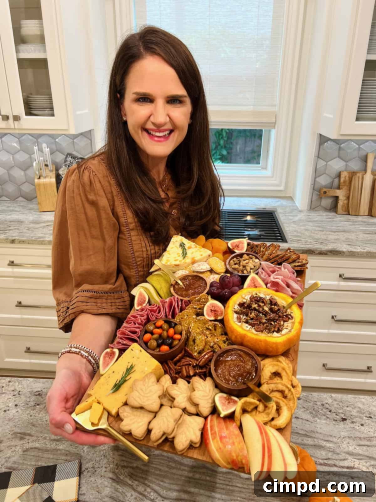 Autumn's Canvas: A Community Art Project 3 Maegan Brown, The BakerMama, proudly showcasing her beautifully arranged Fall Signature Board.