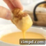 Soft Pretzel Bites with Cheese Sauce by The BakerMama