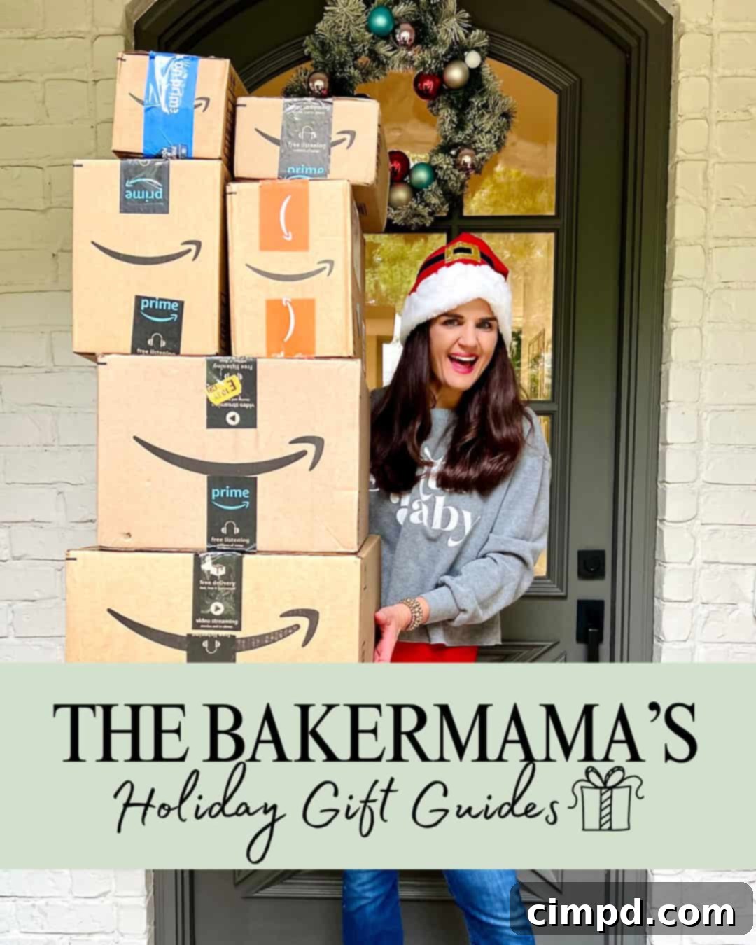 Maegan Brown wearing a Santa hat, smiling brightly and holding a tower of beautifully wrapped Amazon boxes, symbolizing the joy of holiday gift-giving.