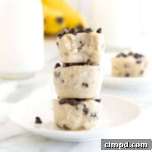 Three banana chocolate chip frozen bites stacked on a white plate.
