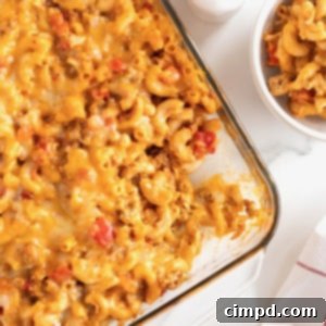 Fiesta Mac and Cheese 17 A glass casserole dish with Mexi Mac and cheese on a white marble counter.