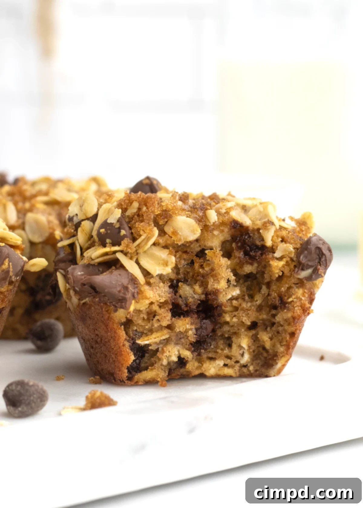 Greek Yogurt Chocolate Chip Oat Muffins 3 Close-up of freshly baked Oatmeal Chocolate Chip Greek Yogurt Muffins, showing their golden tops and tempting chocolate chips.