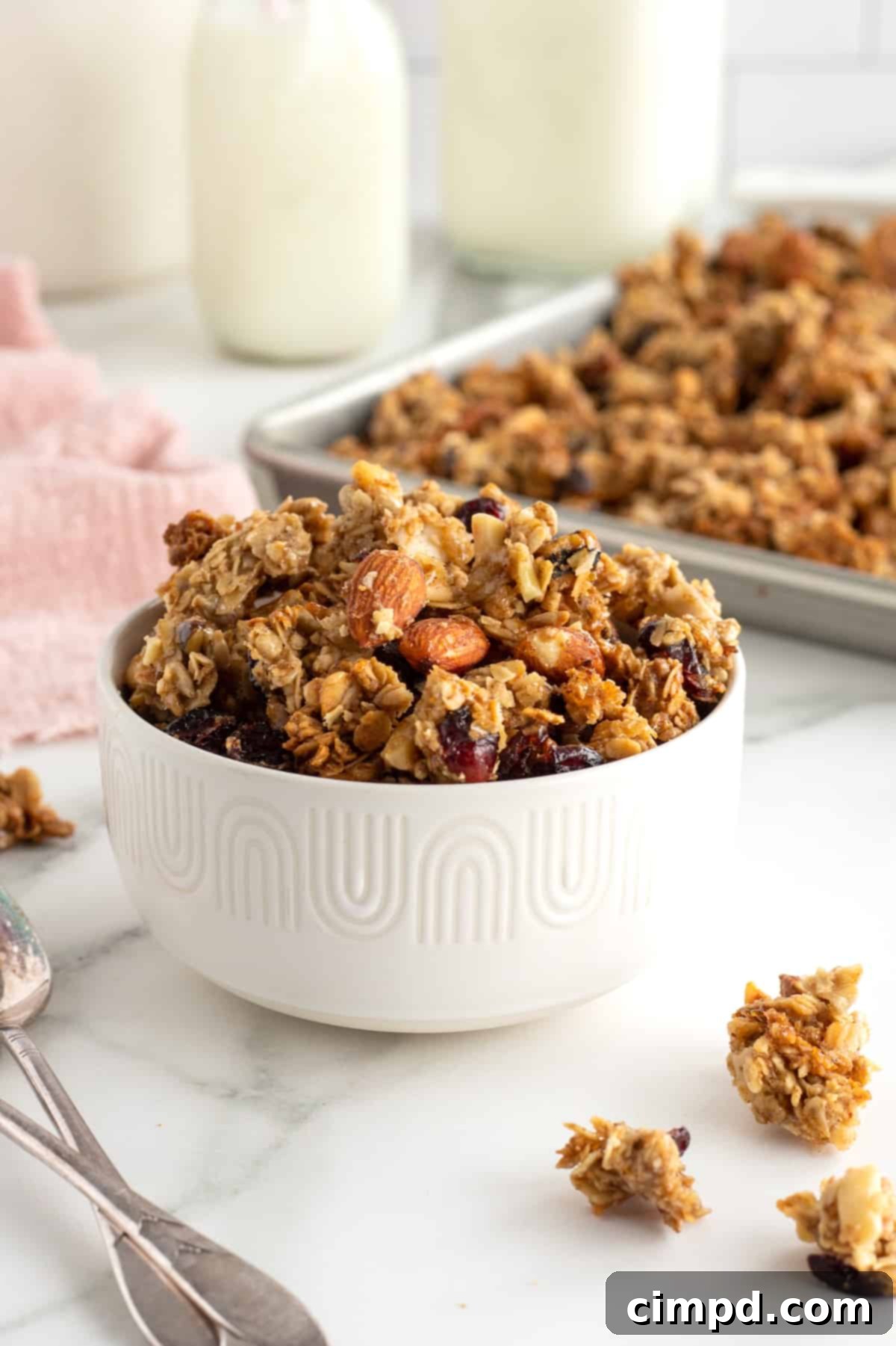 Delicious Chunky Homemade Granola by The BakerMama, perfect for breakfast or snacking.