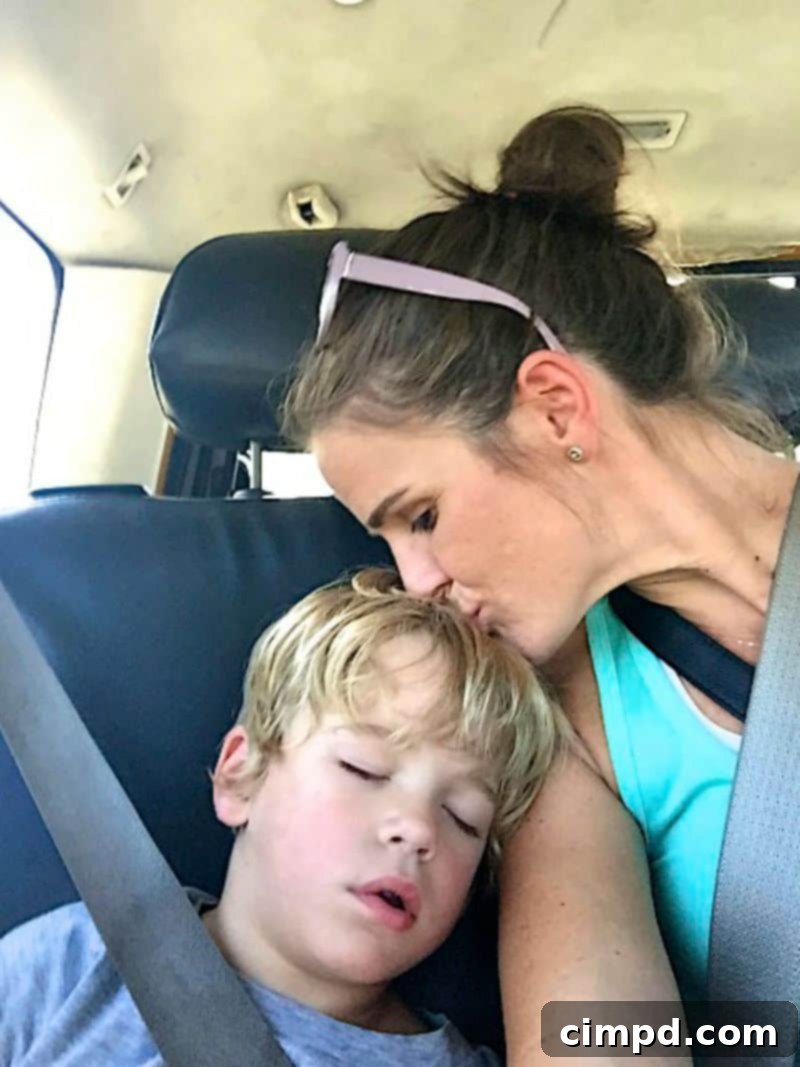 Baker sound asleep in a car, exhausted from his trip