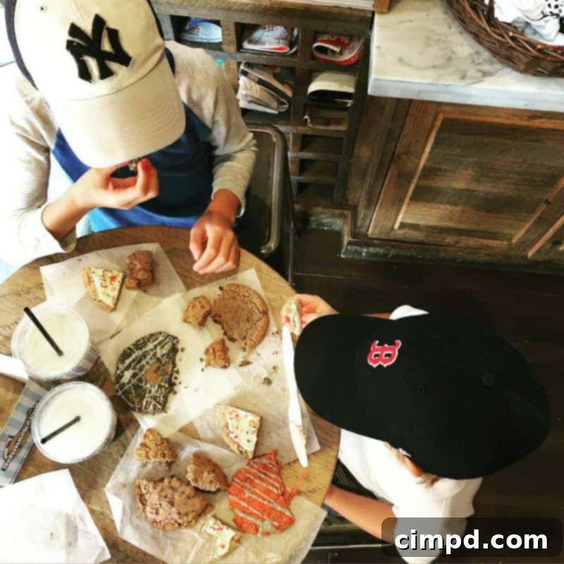 Baker enjoying a large cookie from Schmackary's