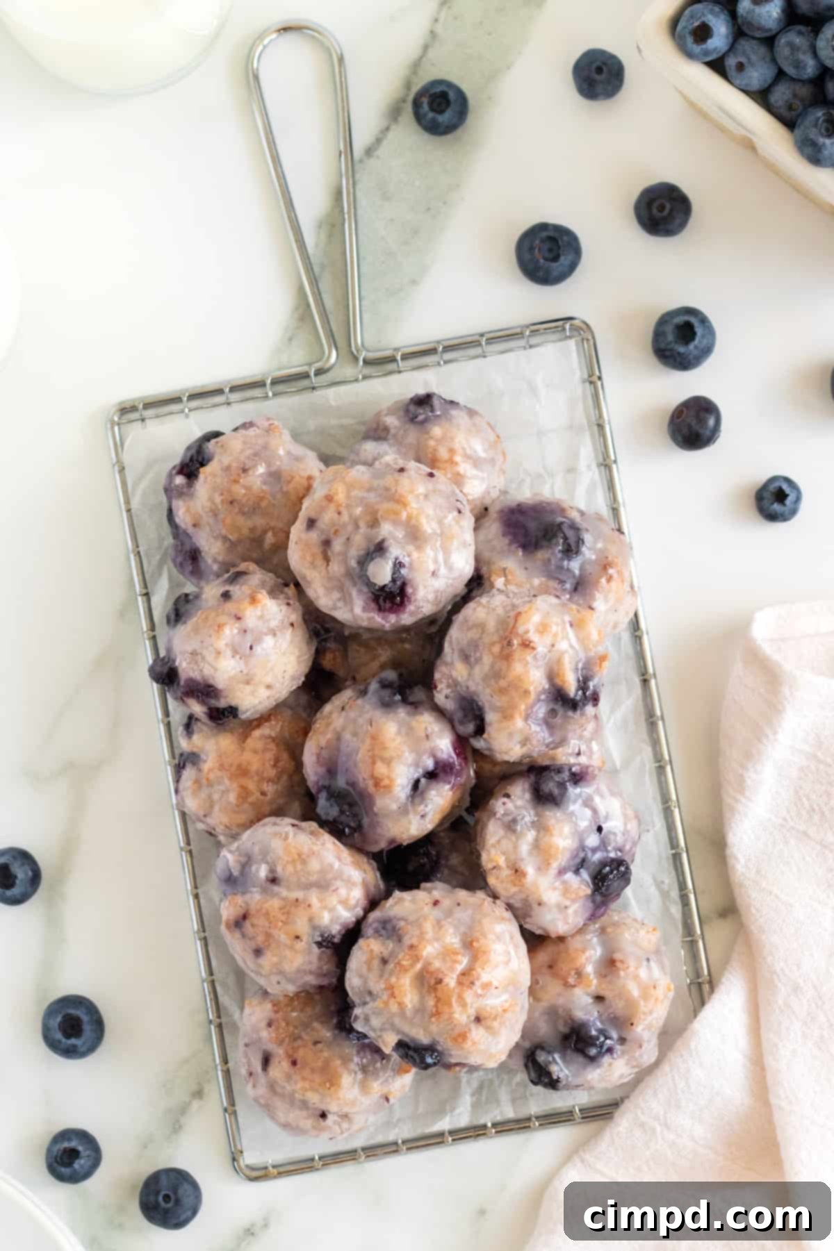 Oven-Baked Blueberry Fritter Poppers 7 An inviting display of Baked Blueberry Fritter Bites, ready to be enjoyed.