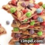 Peanut Butter Berry Bunch Crunch Bark on a white platter