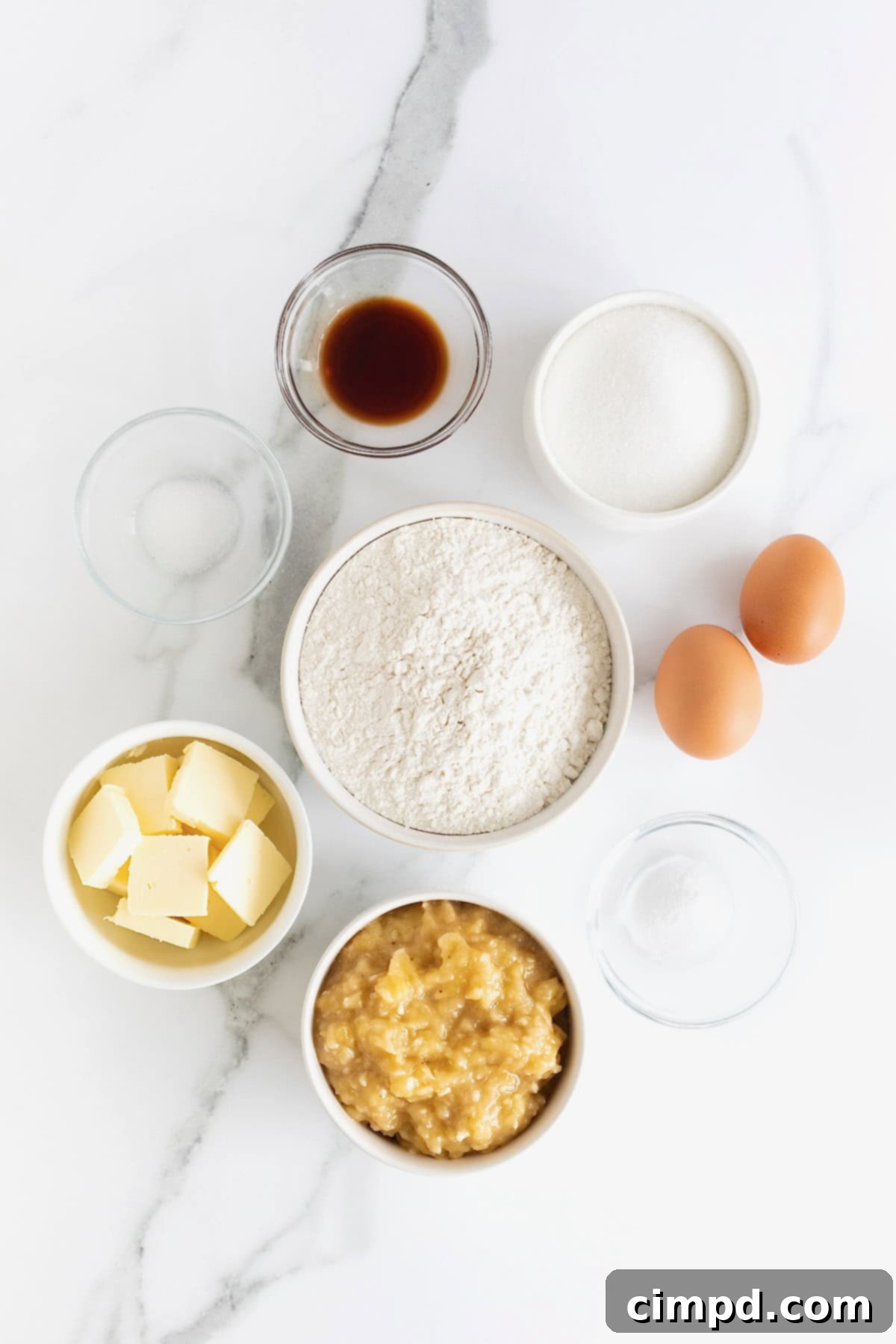 Next Level Brown Butter Banana Bread 5 Ingredients to make brown butter banana bread in small dishes on a white marble counter.