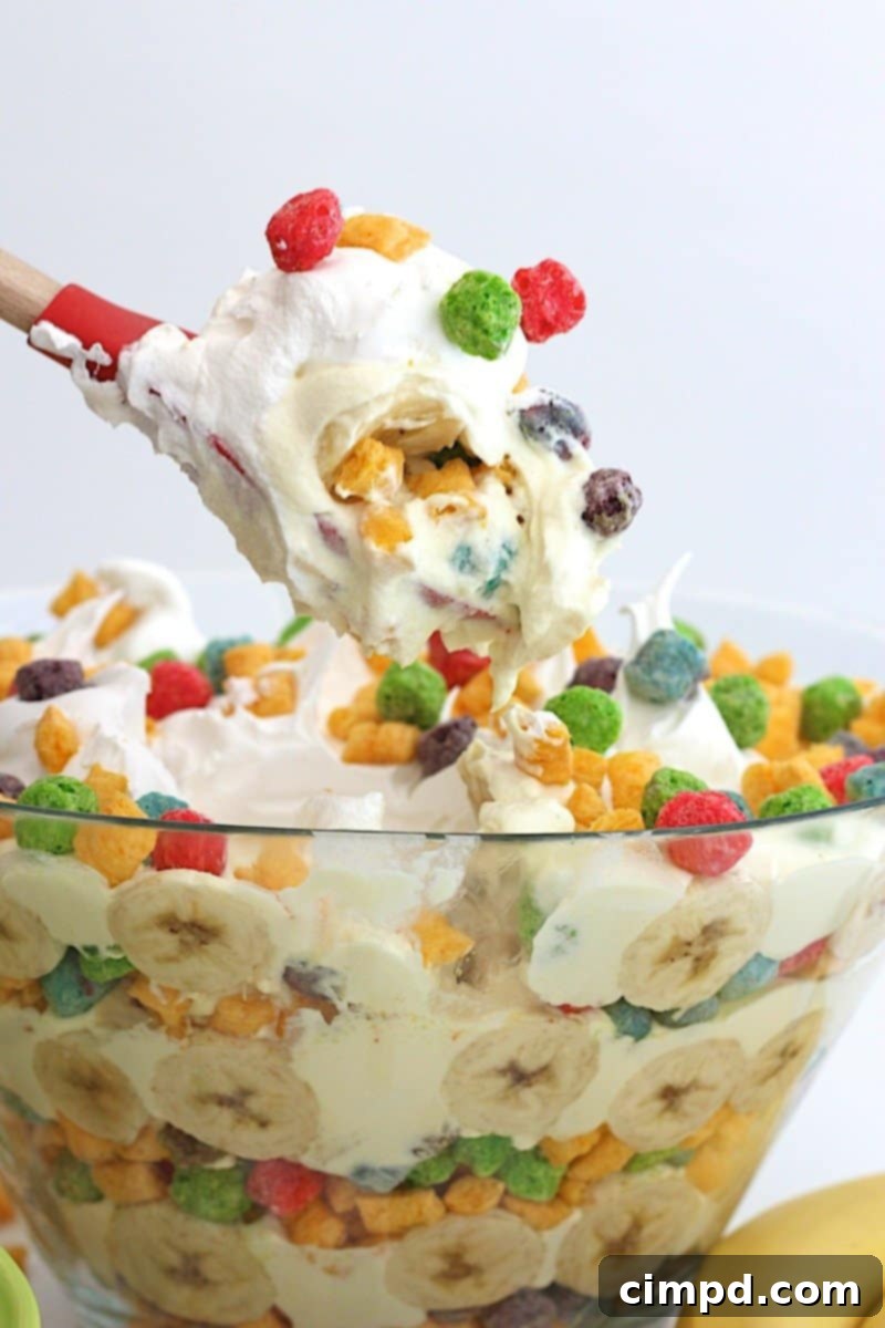 Close-up of Berry Colossal Crunch Banana Pudding layers with bananas and cereal