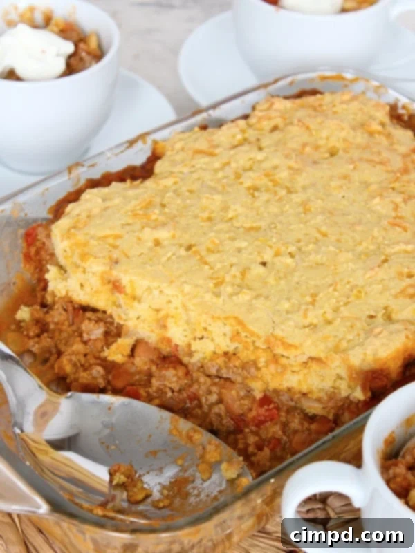 Delicious Chili Cornbread Casserole ready to serve, showing a golden cornbread crust