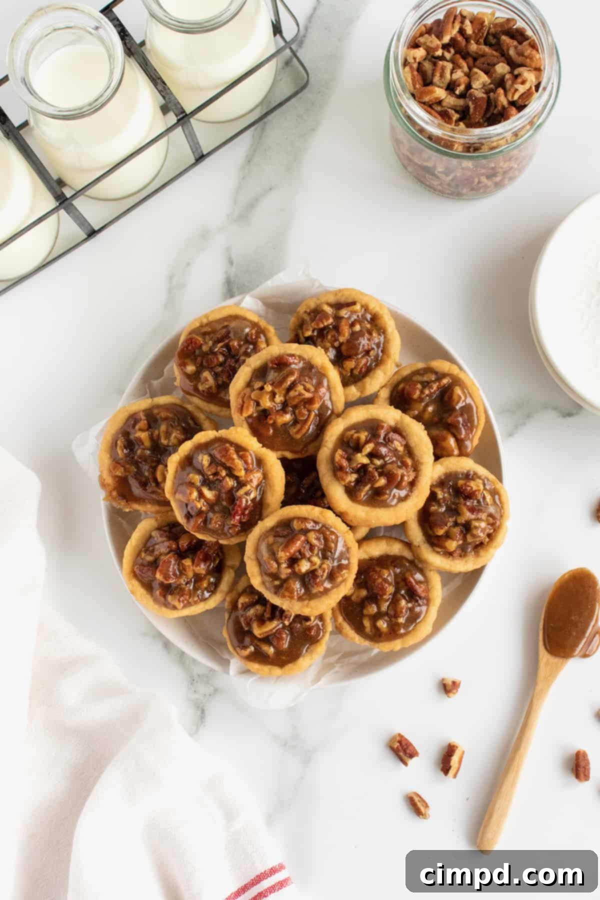 A tray of freshly baked Pecan Pie Bites cooling, with their golden crusts and rich filling.