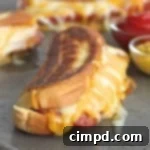 Gooey Grilled Dogwich 2 Grilled Cheese Hot Dogs recipe image
