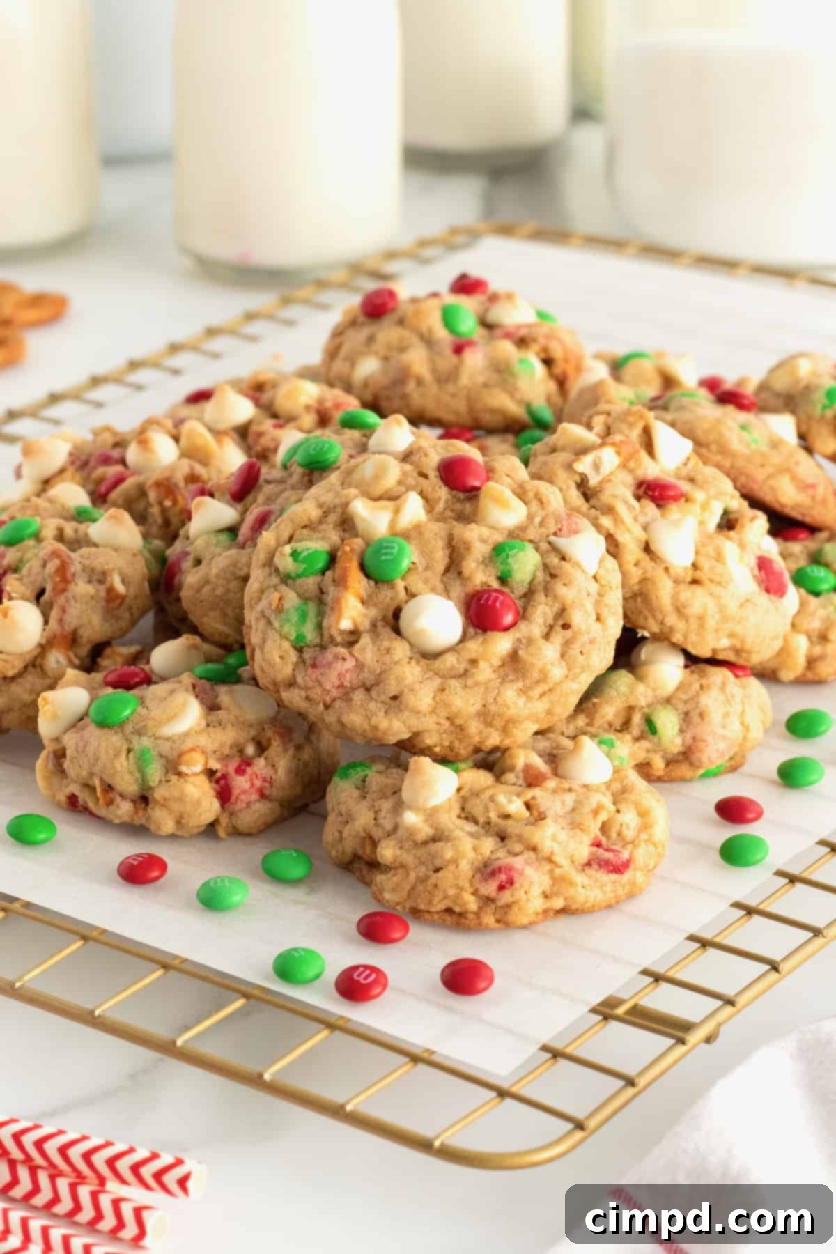 Festive Sleigh Mix Cookies adorned with mini M&Ms and white chocolate chips, perfect for holiday gifting or Santa's treats.
