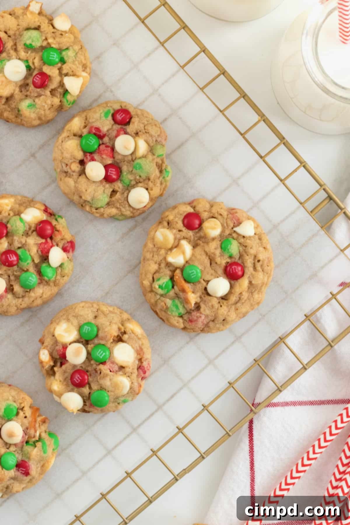 A plate of freshly baked Sleigh Mix Cookies cooling on a wire rack.
