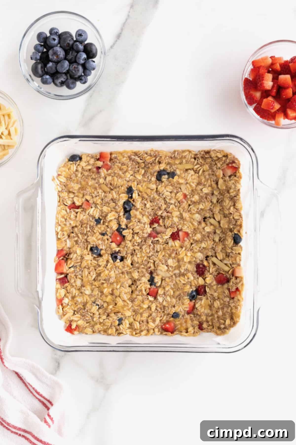 Overnight Oats Bars pressed into an 8x8 glass baking dish lined with parchment.