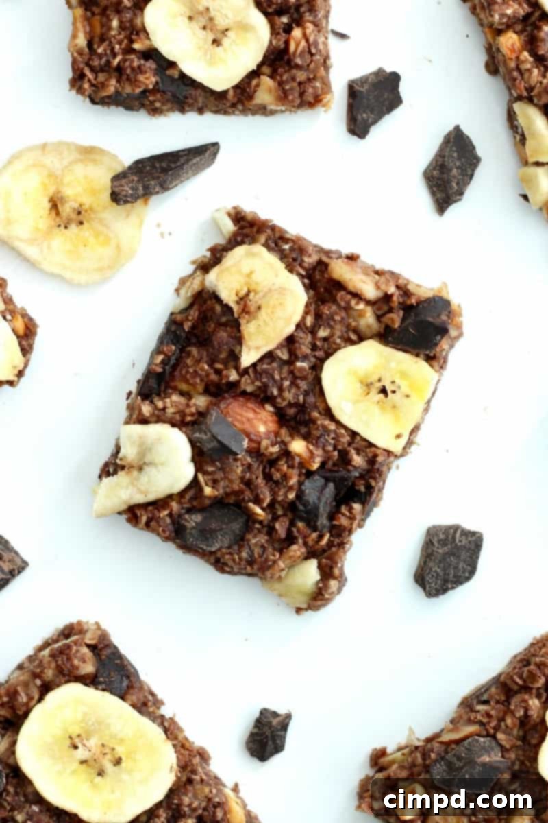 Close-up of a bowl filled with ingredients for No-Bake Chunky Monkey Granola Bars being mixed