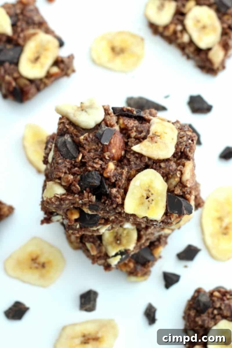 Close-up of a stack of No-Bake Chunky Monkey Granola Bars on a plate, ready to be served