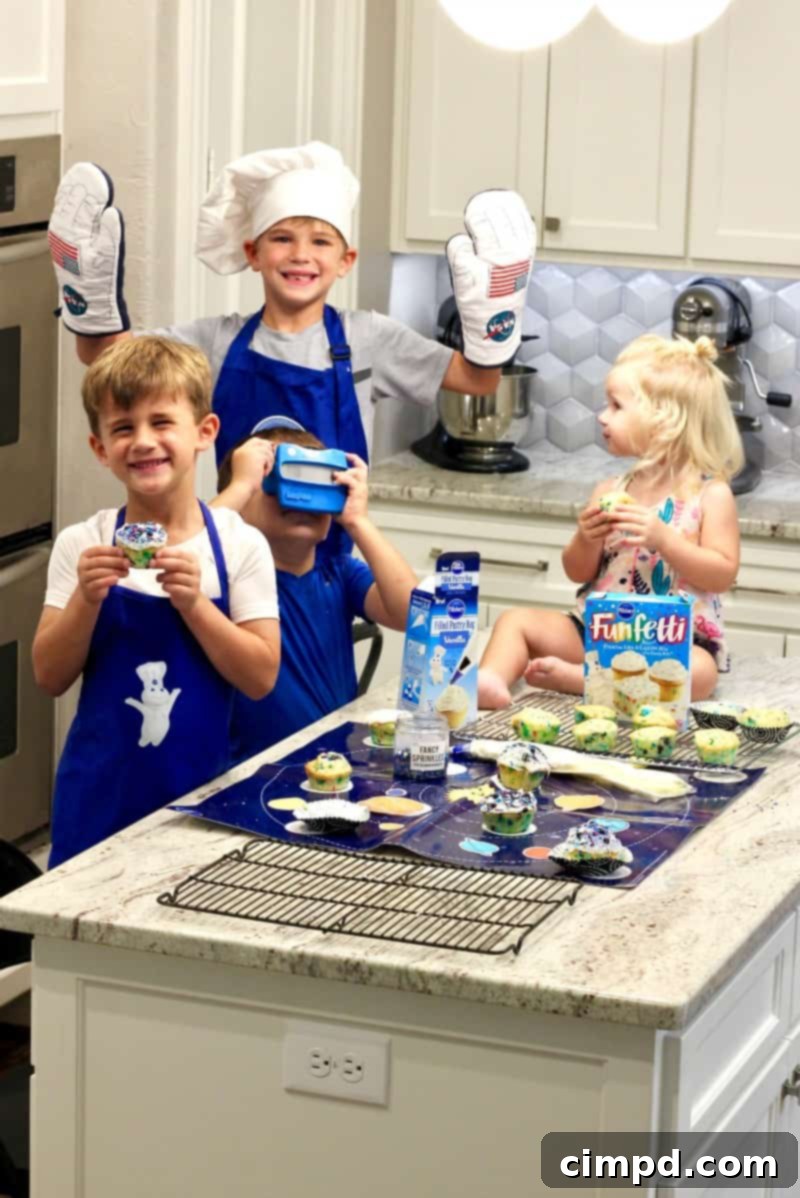 Kids actively involved in making Cosmic Cupcakes, focusing on a mixing bowl