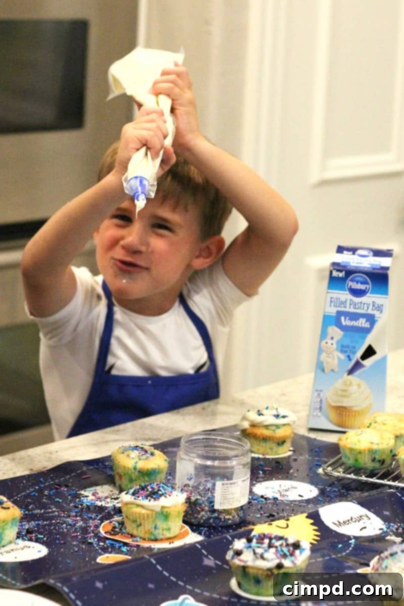 Closeup of a frosted Cosmic Cupcake topped with vibrant galaxy sprinkles