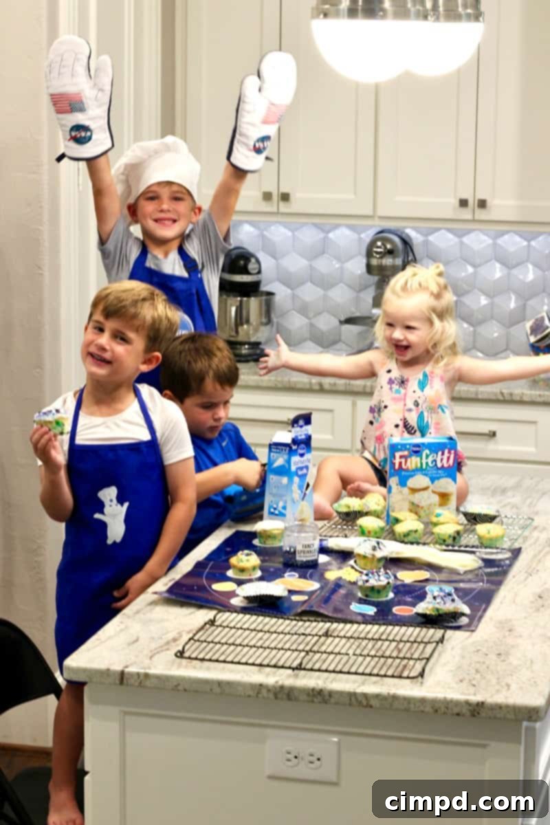 Plate of finished Cosmic Cupcakes, showcasing the vibrant galaxy sprinkles and frosting